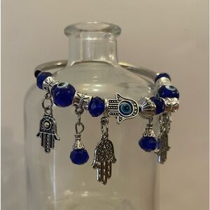 Small blue elastic silver evil eye charm bracelet